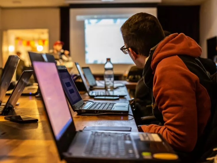 It's a classroom with people at their computers